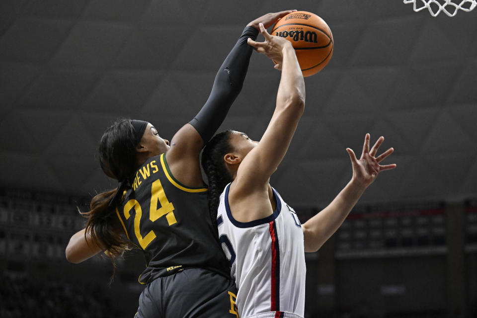 Baylor's Sarah Andrews (24) blocks a shot by UConn's Azzi Fudd in the first half of a second-round college basketball game in the NCAA Tournament, Monday, March 20, 2023, in Storrs, Conn. (AP Photo/Jessica Hill)