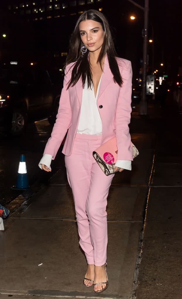 The unabashedly political Emily Ratajkowski wore a pink pantsuit to a NYFW 2017 event. (Photo: Getty Images)