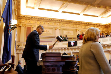 Virginia Lieutenant Governor Justin Fairfax bangs the gavel to start a session of the state senate in Richmond, Virginia, U.S. February 11, 2019. REUTERS/Jonathan Drake