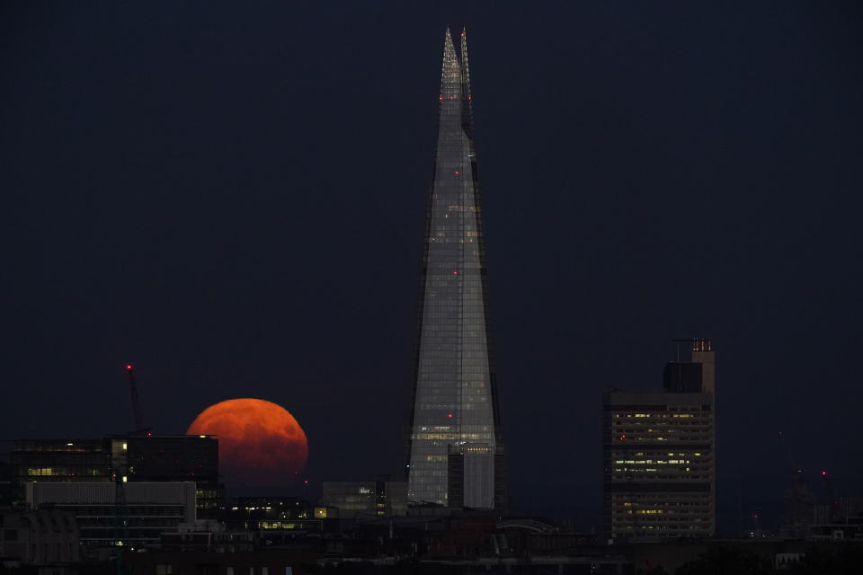 The Sturgeon supermoon, the final supermoon of the year, rises behind The Shard in London. Picture date: Thursday August 11, 2022. (Photo by Yui Mok/PA Images via Getty Images)