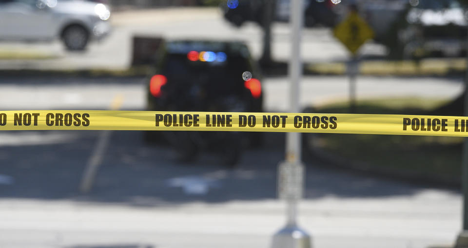 Police tape is drawn in the parking lot at Hamilton Place Mall across from the scene of a possible active shooter, Monday, June 24, 2024, Chattanooga, Tenn. (Matt Hamilton/Chattanooga Times Free Press via AP)