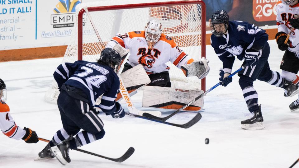 RIT's Tommy Scarfone makes a save against New Hampshire Nov. 25 at Gene Polisseni Center in Henrietta. Scarfone, the reigning Atlantic Hockey goaltender of the year, is one of four transfers signed by Wisconsin this offseason.