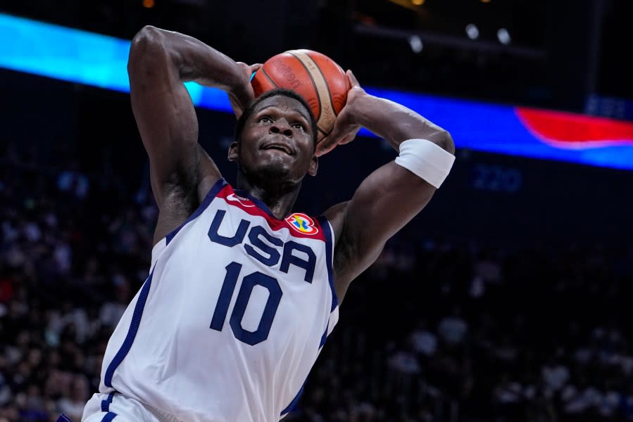 U.S. guard Anthony Edwards (10) gets a dunk against Lithuania during the second half of a Basketball World Cup second-round match in Manila, Philippines Sunday, Sept. 3, 2023.(AP Photo/Michael Conroy)