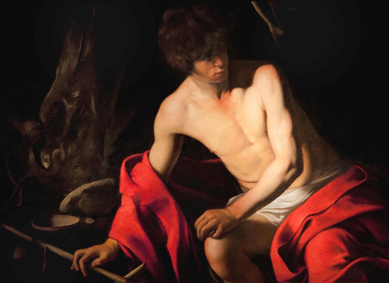 San Juan Bautista, pintura al óleo del artista italiano Caravaggio de 1604. El maestro usaba la grana cochinilla como elemento distintivo de sus creaciones. (Foto dMolteni&Motta/Universal Images Group vía Getty Images)