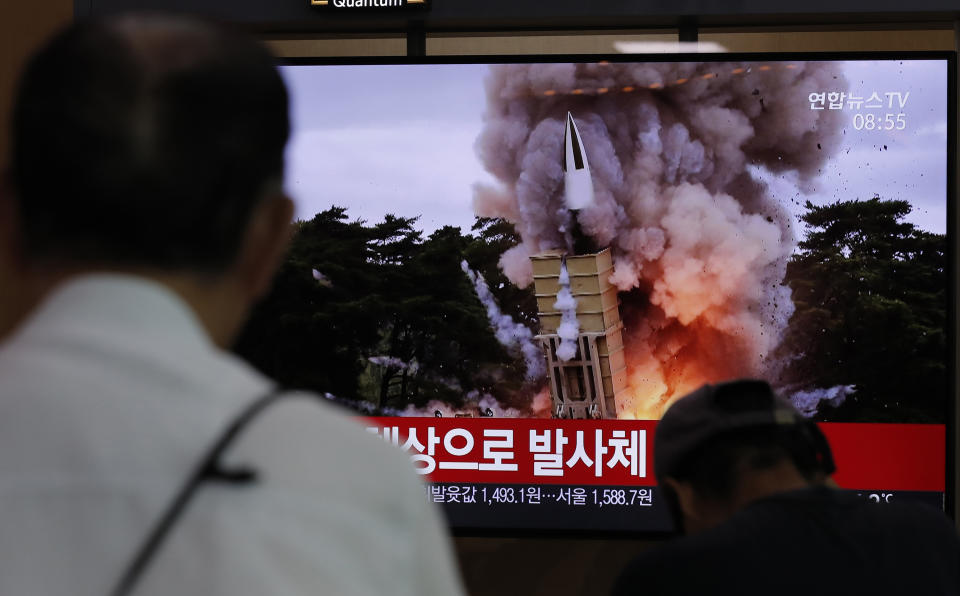 People watch a TV news program reporting North Korea's firing projectiles with a file image at the Seoul Railway Station in Seoul, South Korea, Saturday, Aug. 24, 2019. North Korea fired two suspected short-range ballistic missiles off its east coast on Saturday in the seventh consecutive week of weapons tests, South Korea’s military said, a day after it threatened to remain America’s biggest threat in protest of U.S.-led sanctions on the country. The part of Korean letters read: "Projectiles." (AP Photo/Lee Jin-man)