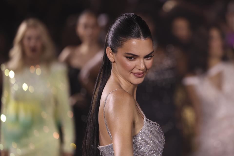 Kendall Jenner wears a creation for the L'Oreal Spring/Summer 2024 womenswear fashion collection presented Sunday, Oct. 1, 2023 in Paris. (AP Photo/Vianney Le Caer)