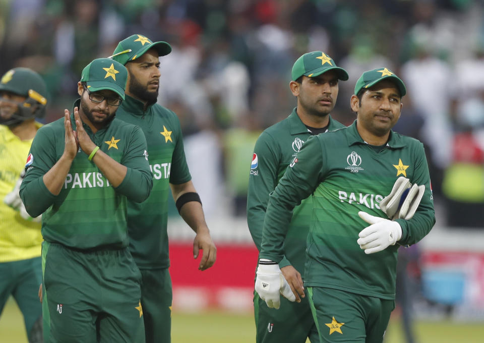 Pakistan's captain Sarfaraz Ahmed right leads the team from the field as they celebrate after they defeated South Africa by 49 runs in their Cricket World Cup match between Pakistan and South Africa at Lord's cricket ground in London, Sunday, June 23, 2019. (AP Photo/Alastair Grant)