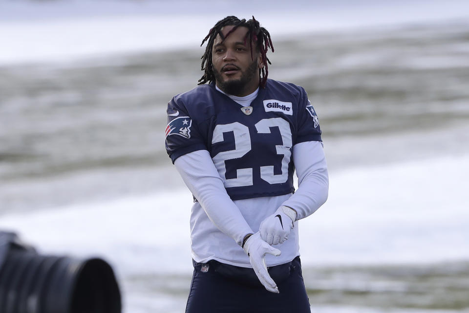 FILE - New England Patriots strong safety Patrick Chung pulls on a glove while warming up during an NFL football practice in Foxborough, Mass., in this Wednesday, Dec. 18, 2019, file photo. More than half of the 67 NFL players who opted out of the 2020 season amid the COVID-19 pandemic are no longer with the same team and almost two dozen aren't on anyone's roster. The Patriots had a league-high eight players opt out, including safety Patrick Chung and fullback Dan Vitale, both of whom retired this year along with two other opt outs: Cardinals O-lineman Marcus Gilbert and Panthers linebacker Jordan Mack. (AP Photo/Steven Senne, File)