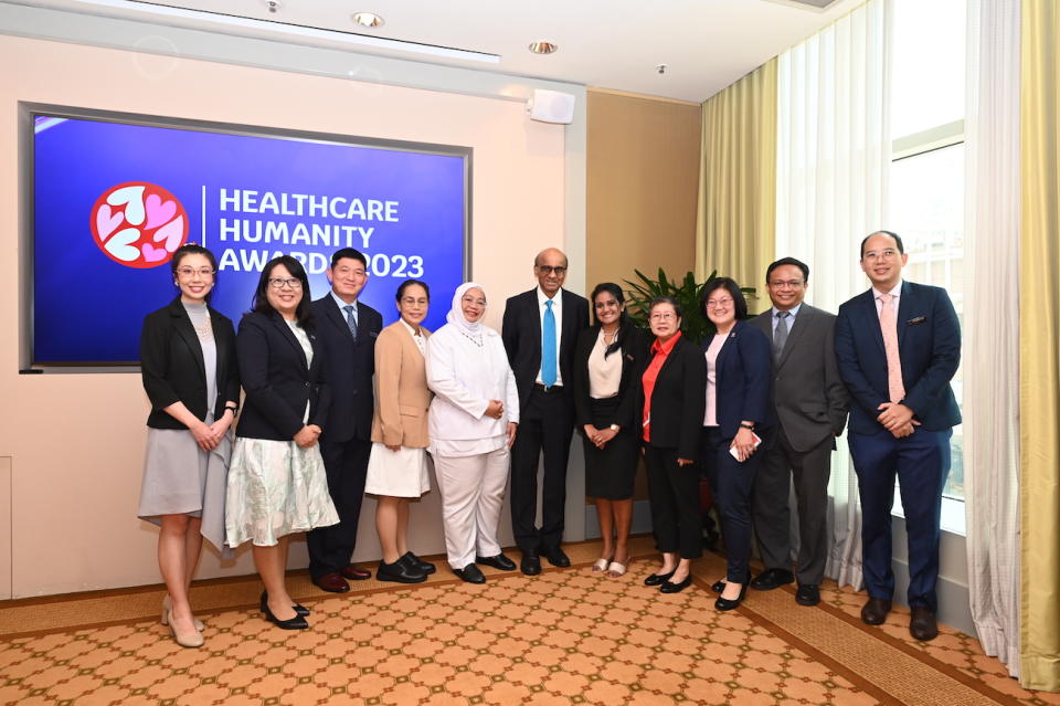 President Tharman Shanmugaratnam with some of the award winners at the Healthcare Humanity Awards. 