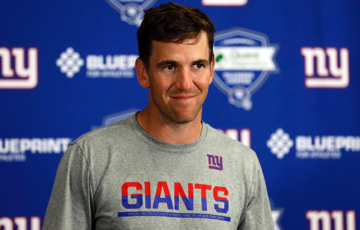 Eli Manning seemed to enjoy tallying his ring count next to Odell Beckham Jr's on Thursday. (AP)
