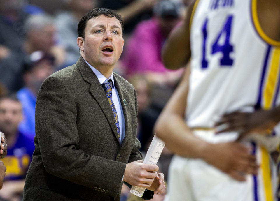 FILE - Then-LSU assistant coach Greg Heiar, center, shouts from the sideline during the team's NCAA men's college basketball tournament game against Yale in Jacksonville, Fla., March 21, 2019. New Mexico State suspended operations of its men's basketball program indefinitely Friday night, Feb. 10, 2023, and placed its coaching staff, including Heiar, on paid administrative leave. ( AP Photo/Stephen B. Morton, File)