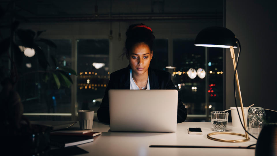 businesswoman working late with her laptop