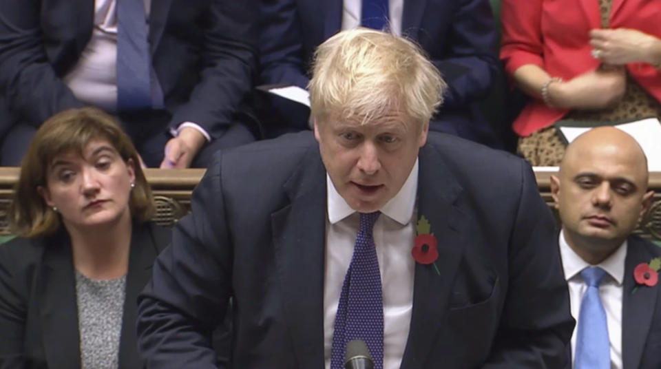 Britain's Prime Minister Boris Johnson speaks to lawmakers during the election debate in the House of Commons, London, Monday Oct. 28, 2019. The EU agreed Monday to a three month delay in Britain's Brexit departure from the bloc, and parliament will vote on Monday if to have a General Election. (House of Commons via AP)