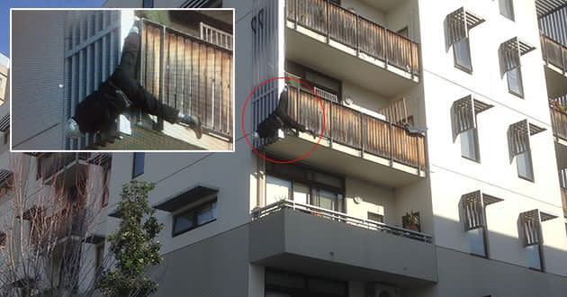 A wayward tradesman left dangling by his foot from a balcony. Photo: Supplied