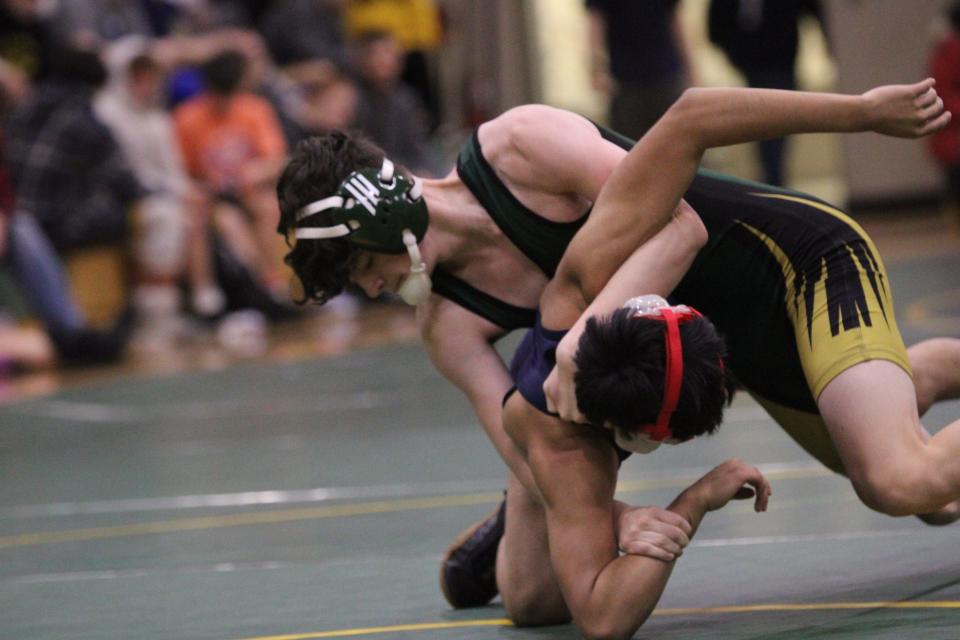 Caleb Totten of St. Mary Catholic Central takes his opponent to his back Saturday during the New Year's Duals at SMCC.