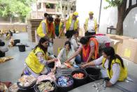 Indian volunteers pack relief materials to be sent to Nepal's earthquake affected people, in Ahmedabad on May 2, 2015