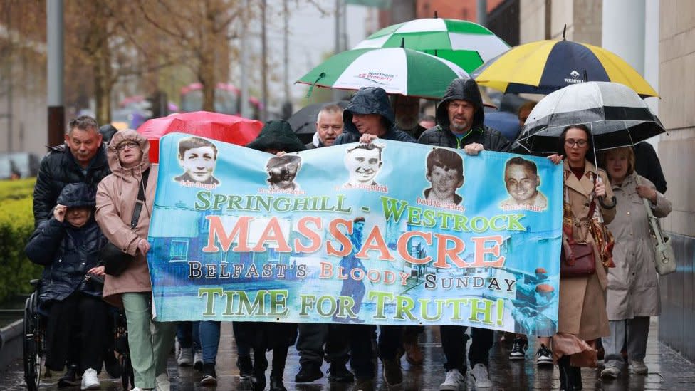 Relatives of those was killed during the Springhill killings, outside the coroners court at Laganside in Belfast on Monday