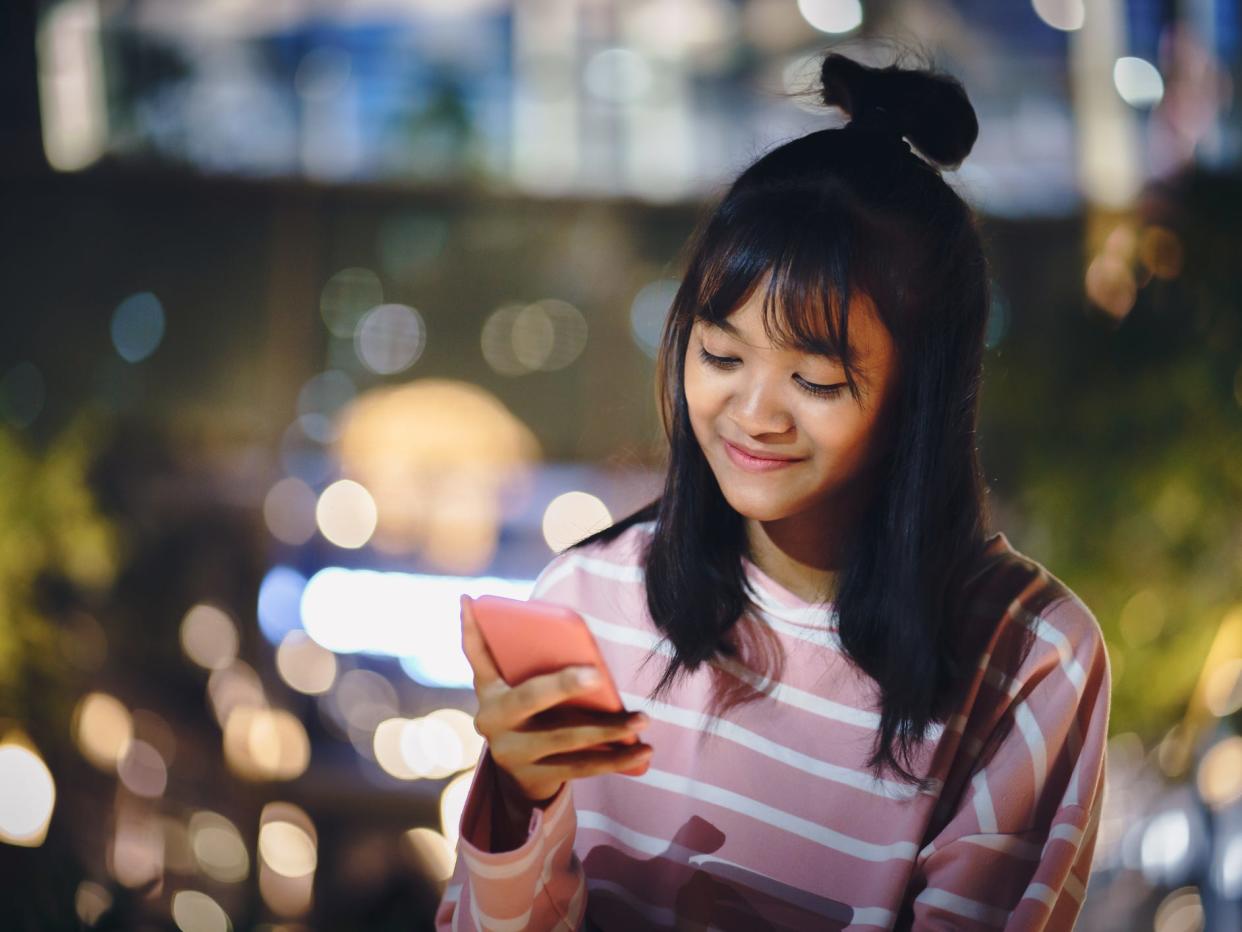 Teen looking at phone