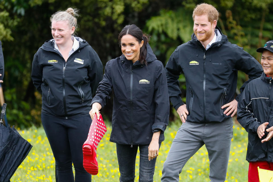 The royal couple joined a group of children from ‘Trees in Survival’ to see who could throw their boots the furthest. Photo: Getty