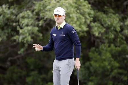 Apr 20, 2018; San Antonio, TX, USA; Zach Johnson waves to the gallery after a birdie putt on the seventeenth green during the second round of the Valero Texas Open golf tournament at TPC San Antonio - AT&T Oaks Course. Mandatory Credit: Soobum Im-USA TODAY Sports