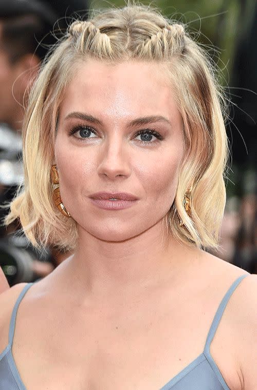 Miller looked adorable with her braided back hairpieces, nude pout and neutral shadow at the closing ceremony and <i>Le Glace Et Le Ciel (Ice And The Sky)</i> premiere during the 68th annual Cannes film festival.
