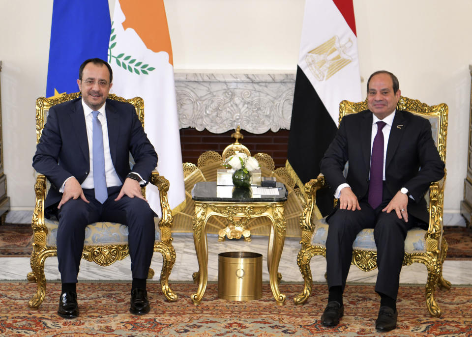 In this photo provided by Egypt's presidency media office, Egyptian President Abdel-Fattah el-Sissi, right, meets his Cyprus counterpart Nikos Christodoulides, left, at the Presidential Palace in Cairo, Egypt, Sunday, March 17, 2024. (Egyptian Presidency Media Office via AP)