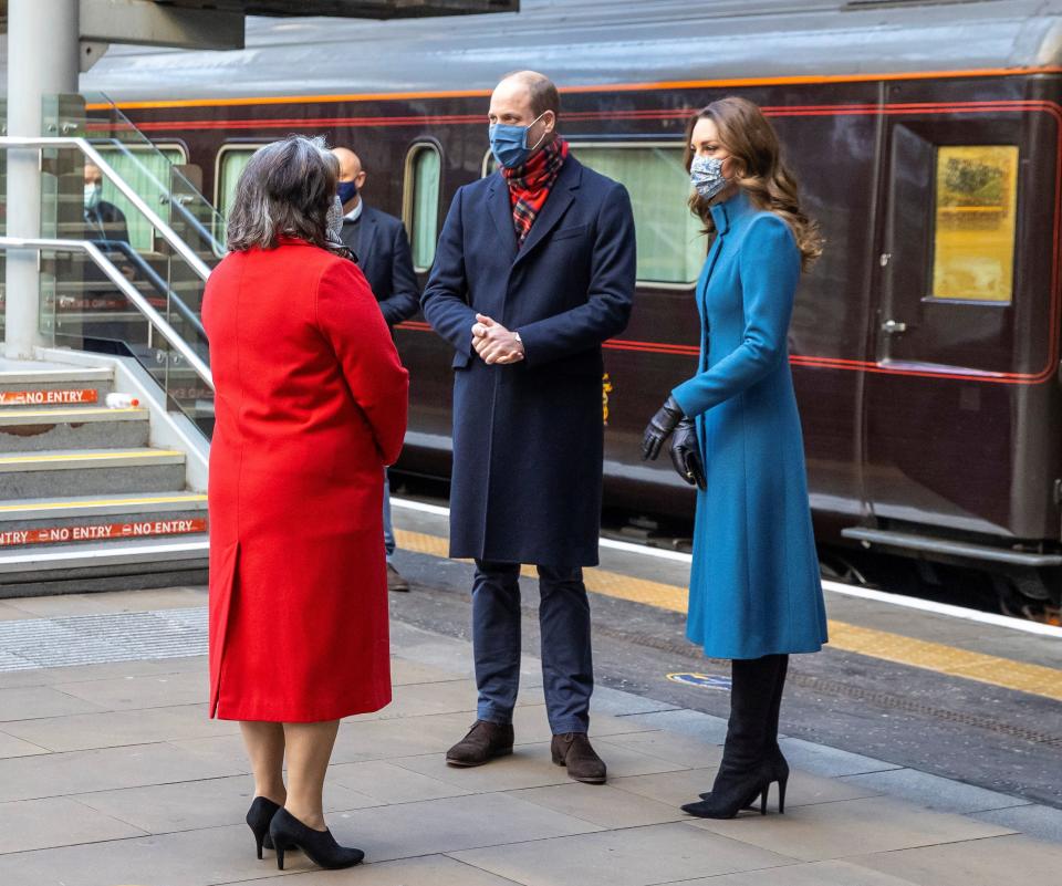 Britain's Prince William and Catherine, Duchess of Cambridge are met by Deputy Lord Lieutenant Sandra Cumming as they arrive by train at Edinburgh Waverley Station on the second day of a three-day tour across the country, in Scotland, Britain December 7, 2020. During the tour William and Kate will visit communities, outstanding individuals and key workers to thank them for their efforts during the coronavirus pandemic. Andy Barr/PA Wire/Pool via REUTERS