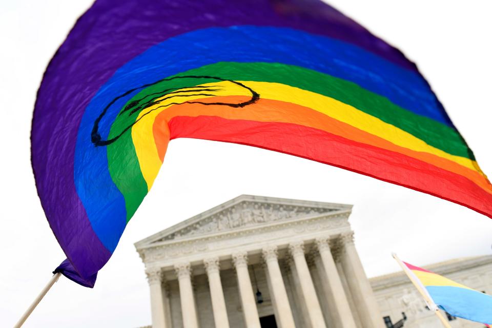 Protesters gather outside the Supreme Court in Washington.