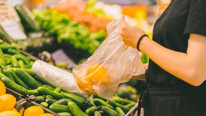 woman doing shopping with plastic bag.