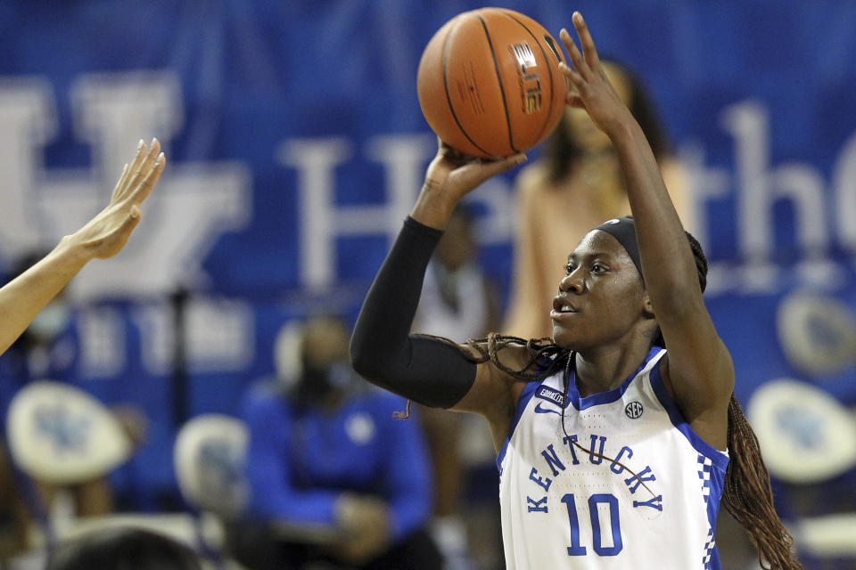 FILE - Kentucky's Rhyne Howard (10) shoots near South Carolina's Eniya Russel during the first half of an NCAA college basketball game in Lexington, Ky., in this Sunday, Jan. 10, 2021, file photo. Howard made The Associated Press All-America first team, announced Wednesday, March 17, 2021. (AP Photo/James Crisp, File)