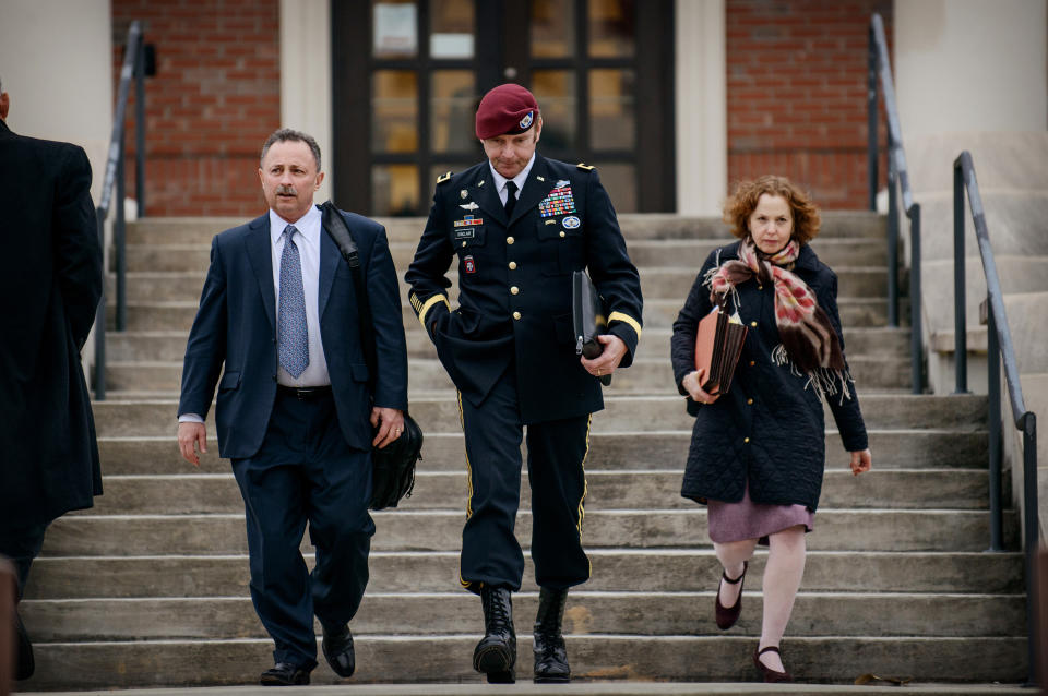 Brig. Gen. Jeffrey Sinclair leaves the courthouse with his lawyers Richard Scheff, left, and Ellen C. Brotman, following a day of motions Tuesday, March 4, 2014, at Fort Bragg, N.C. Less than a month before Sinclair's trial on sexual assault charges, the lead prosecutor broke down in tears Tuesday as he told a superior he believed the primary accuser in the case had lied under oath. (AP Photo/The Fayetteville Observer, James Robinson)