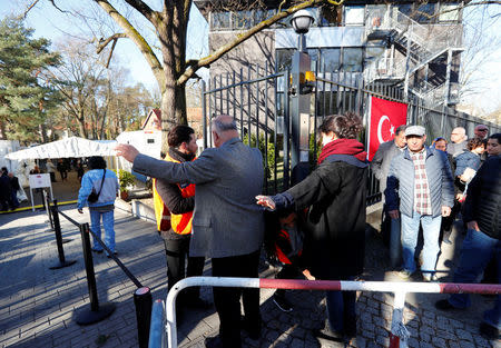 Turkish voters living in Germany go through security checks to cast their ballots on the constitutional referendum at the Turkish consulate in Berlin, Germany, March 27, 2017. REUTERS/Fabrizio Bensch