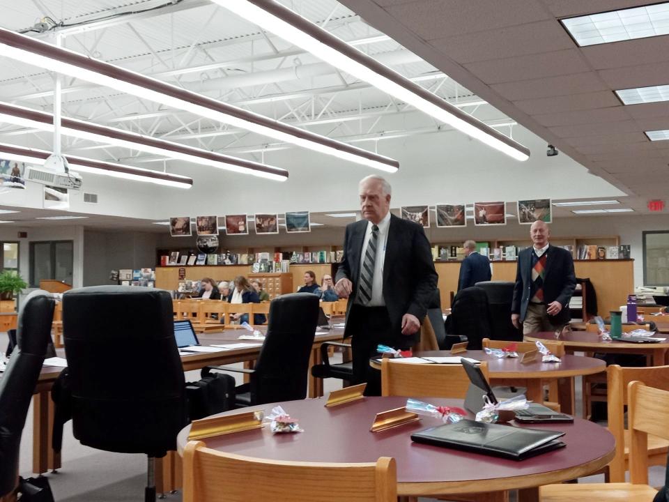 Chairperson John Spall led the return to reopen the Feb. 12, 2024, Wallenpaupack school board meeting after abruptly adjourning for a few minutes when a visitor refused to yield to the five-minute public comment limit. The rest of the board and administrators followed behind Spall. Board member John Kiesendahl returns to his seat, at right.