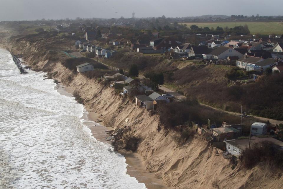 Houses sitting on the cliff edge on The Marrams in Hemsby, Norfolk. (PA)