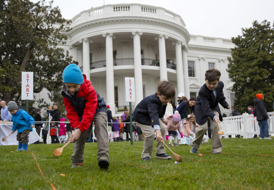 <p>From l-r., Seamus Menefee, 7, from Burke, Va., Skye Kennedy, 5, and his brother Jack Kennedy, 8, both from Montclair, N.J., participates in the annual White House Easter Egg Roll on the South Lawn of the White House in Washington, Monday, April 2, 2018. (Photo: Pablo Martinez Monsivais/AP) </p>