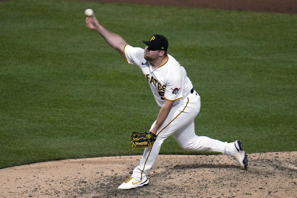 Pittsburgh Pirates relief pitcher David Bednar delivers during the ninth inning of the team's baseball game against the Cincinnati Reds in Pittsburgh, Friday, April 21, 2023. The Pirates won 4-2. (AP Photo/Gene J. Puskar)