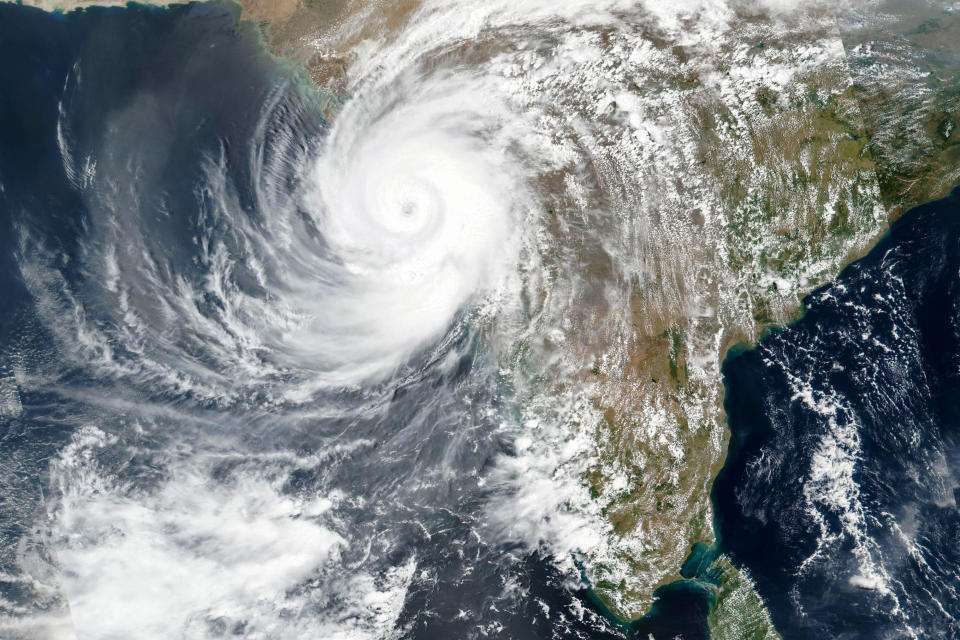 This Monday, May, 17, 2021, satellite image released NASA shows Cyclone Tauktae approaching India's western coast. The powerful cyclone that emerged in the Arabian Sea made landfall on India's western coast on Monday. (NASA Worldview, Earth Observing System Data and Information System (EOSDIS) via AP)