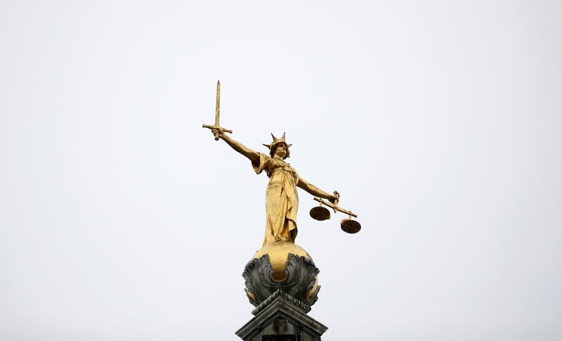 Statue of Lady Justice is seen at Old Bailey central criminal court in London