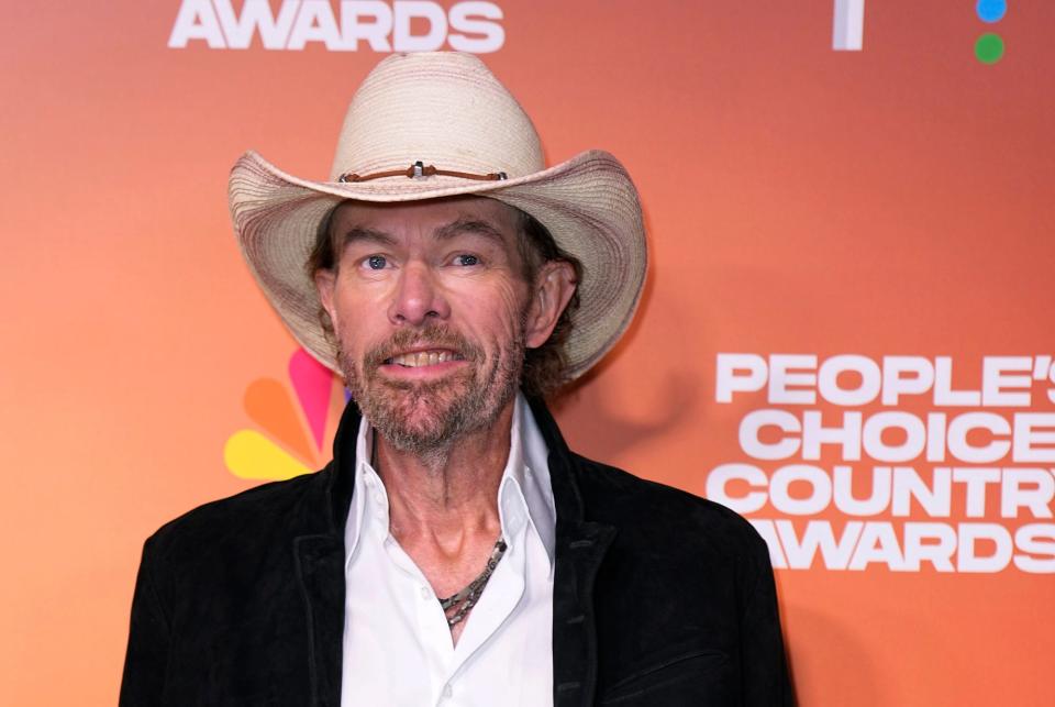 FILE - Toby Keith arrives at the People's Choice Country Awards on Thursday, Sept. 28, 2023, at The Grand Ole Opry House in Nashville, Tenn. “Beer For My Horses” singer-songwriter Toby Keith has died. He was 62. Keith passed peacefully on Monday, Feb. 5, 2024 surrounded by his family, according to a statement posted on the country singer's website. (AP Photo/George Walker IV, File)