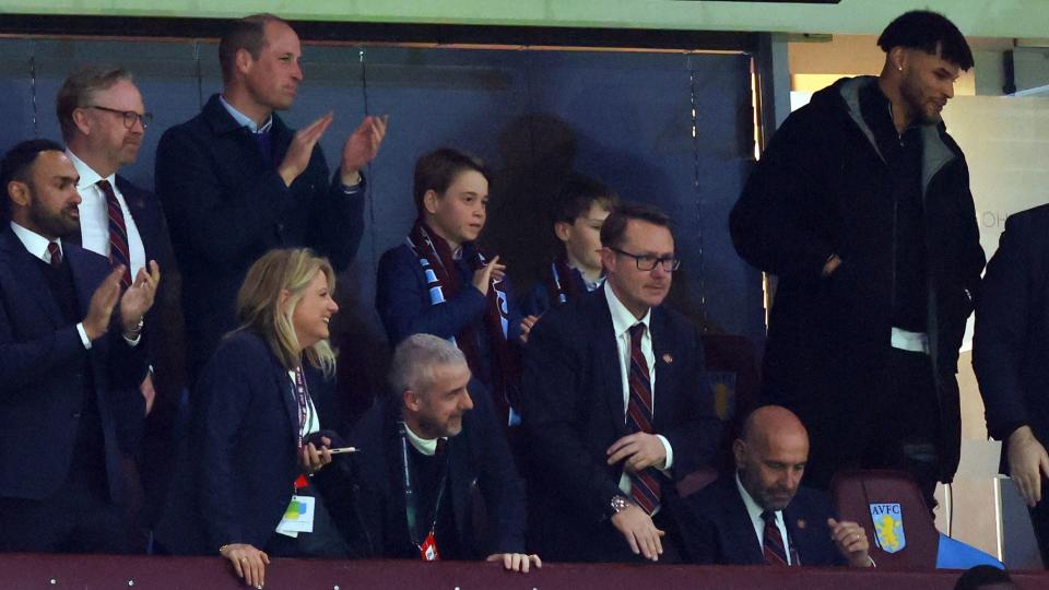 Prince William, Prince of Wales and Prince George of Wales look on alongside Tyrone Mings of Aston Villa during the UEFA Europa Conference League 2023/24 Quarter-final 