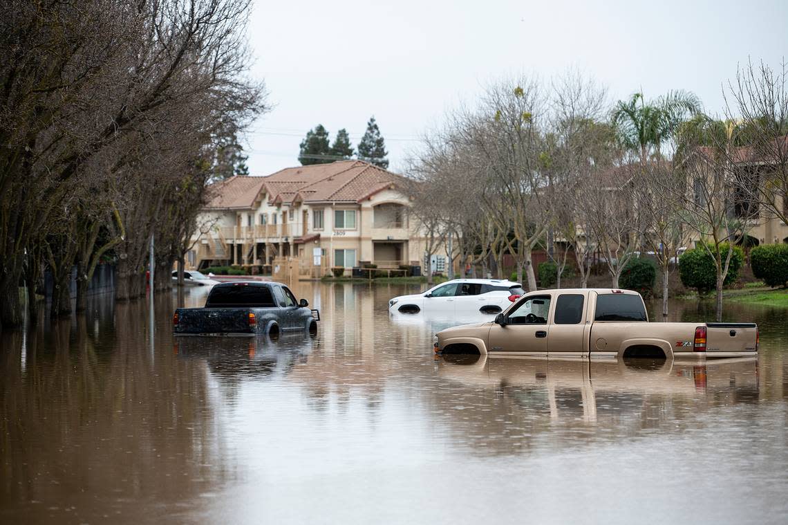 A section of Willowbrook Drive near Carol Gabriault Park remains flooded in Merced, Calif., on Wednesday, Jan. 11, 2023.