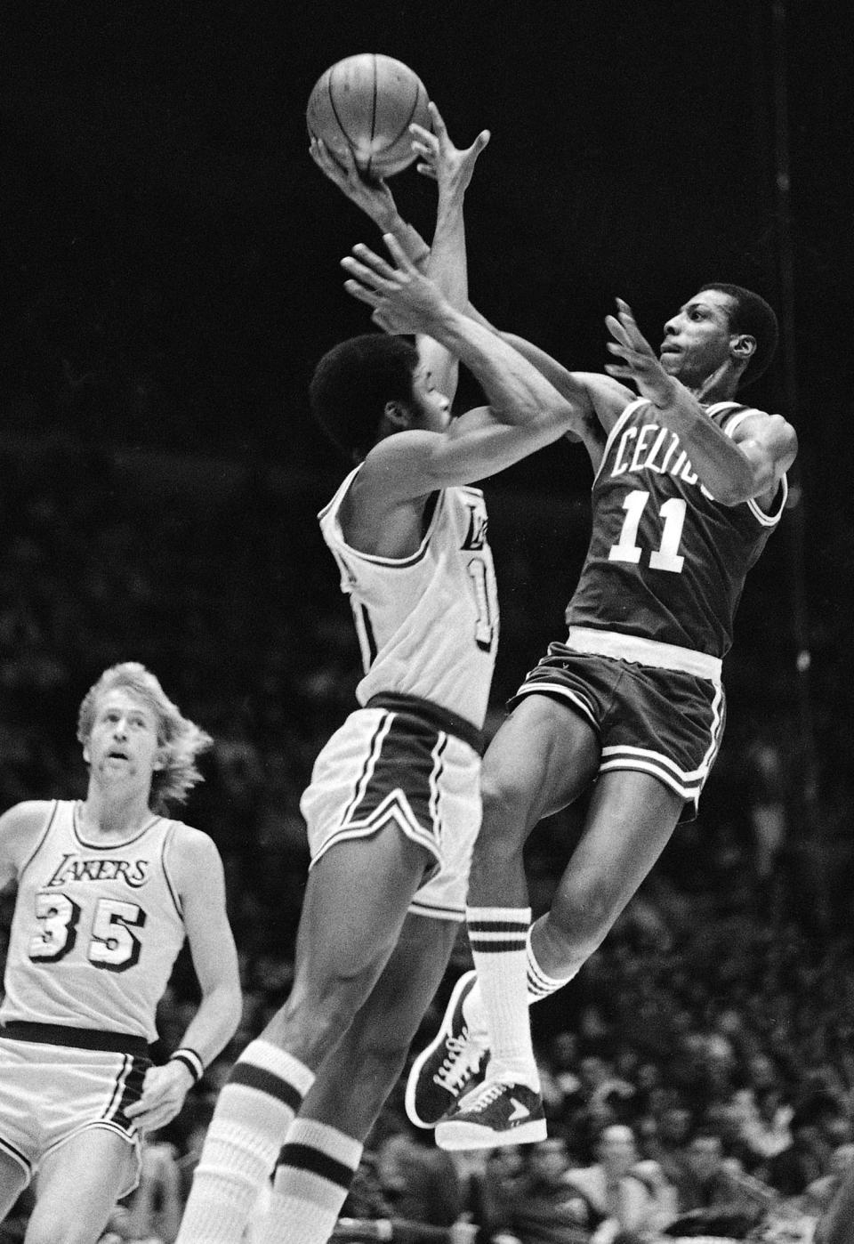 Charlie Scott (11) as a member of the Boston Celtics in 1977. (AP Photo/Lennox McLendon, File)