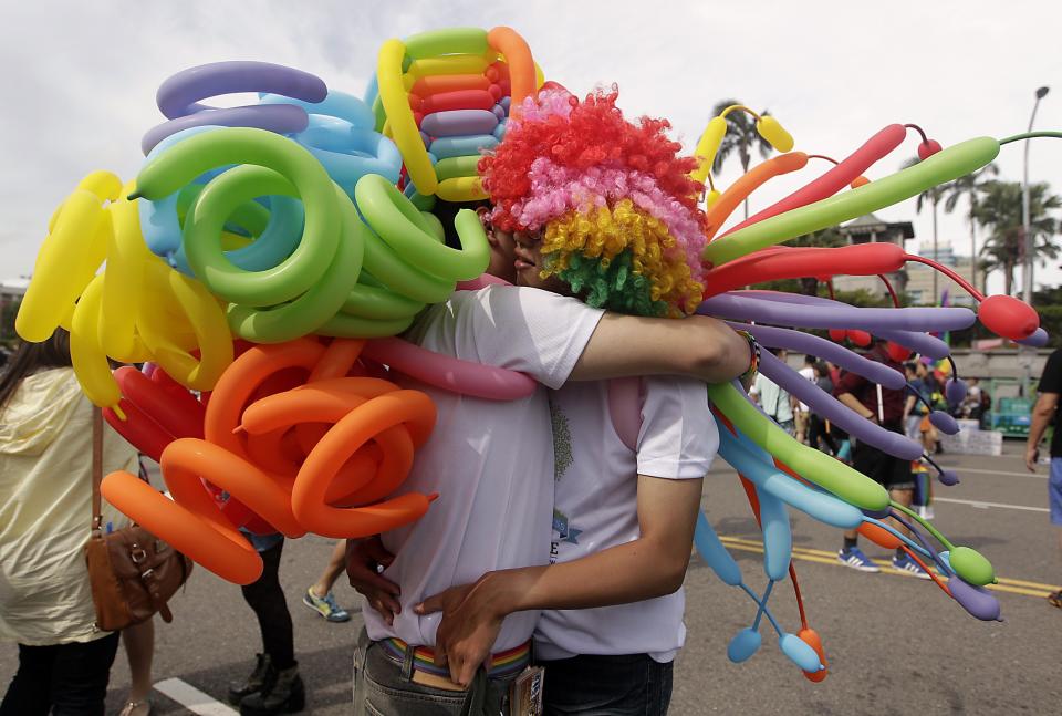 A couple hugs during the Taiwan LGBT Pride Parade in Taipei
