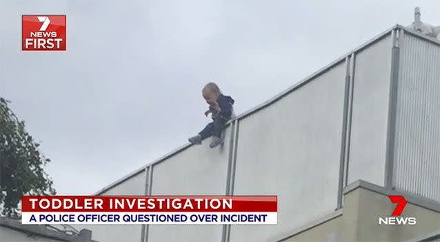 A neighbour spotted the dangling toddler on Melbourne Cup Day. Source: 7 News