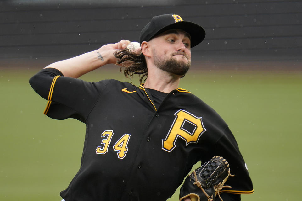 Pittsburgh Pirates starting pitcher JT Brubaker delivers during the first inning of a baseball game against the Philadelphia Phillies in Pittsburgh, Sunday, July 31, 2022. (AP Photo/Gene J. Puskar)