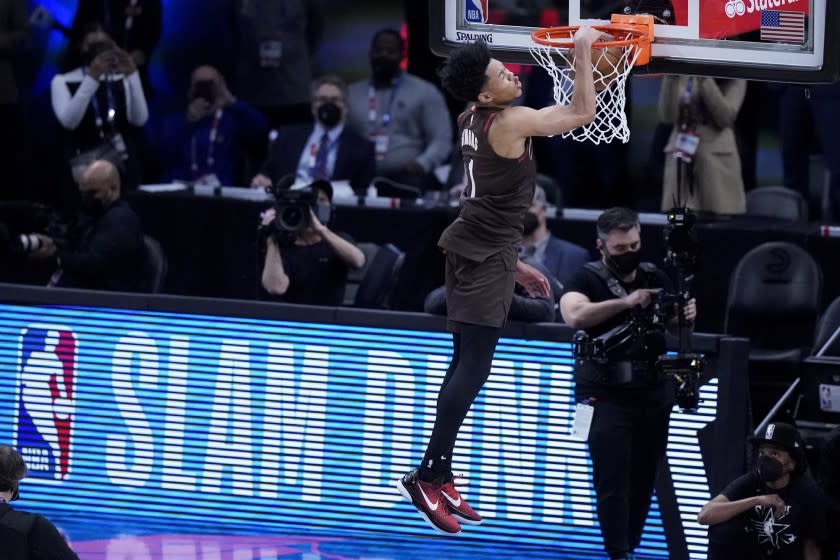 Portland Trail Blazers' Anfernee Simon competes in the Slam Dunk contest during basketball's NBA All-Star Game in Atlanta, Sunday, March 7, 2021. (AP Photo/Brynn Anderson)