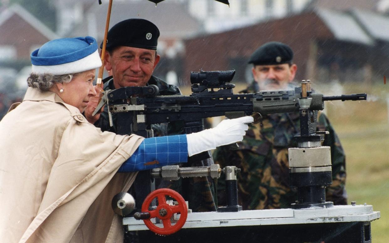 A picture of Queen Elizabeth II firing the SA-80 rifle at Bisley from 1993 - Daily Mail 