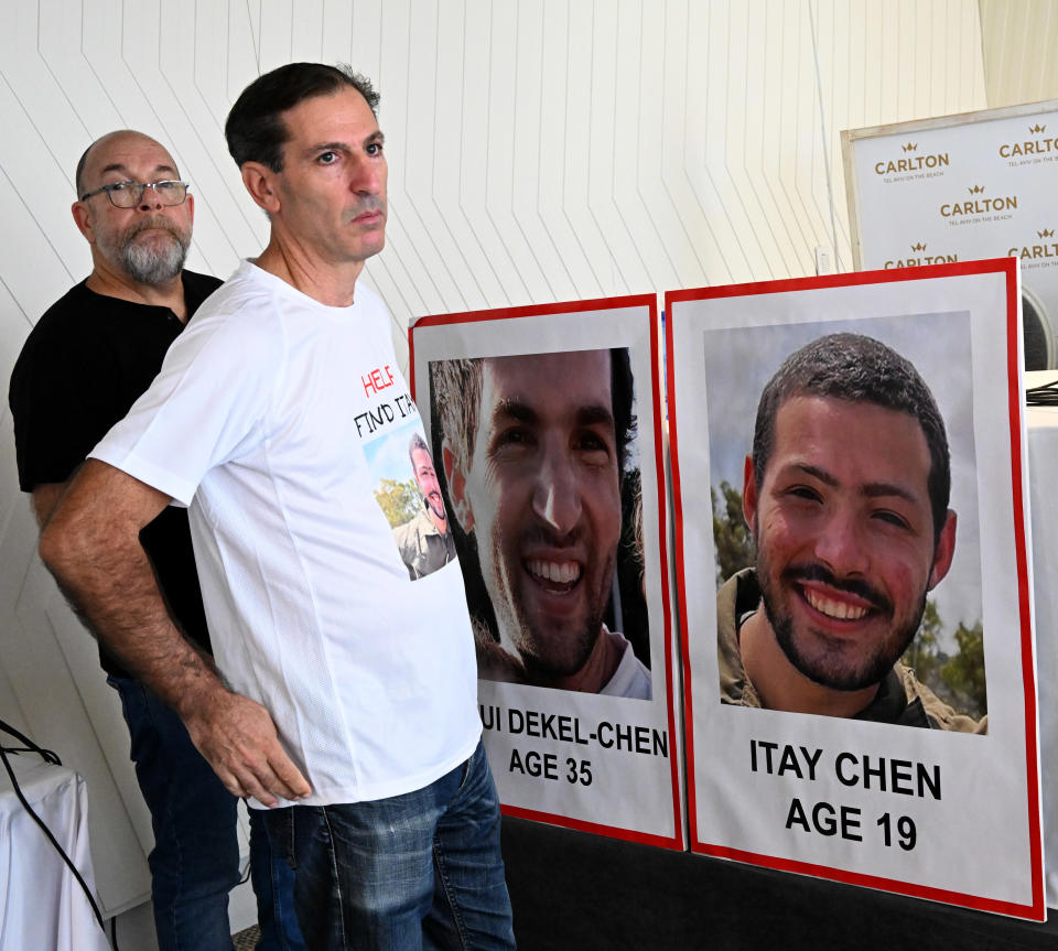 American-Israeli fathers Jonathan Dekel-Chen, left, and Ruby Chen, whose sons, Sagui Dekel-Chen, 35, and Itay Chen, 19, were taken hostage by Hamas on the Gaza border wait for a press conference in Tel Aviv, Israel, on Tuesday. 