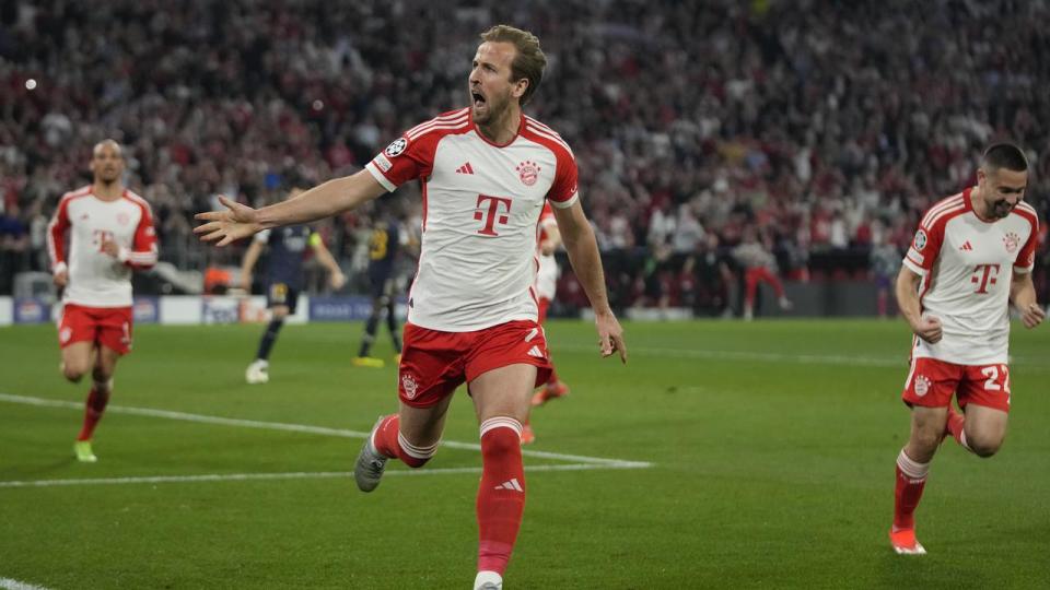 Harry Kane celebrates his penalty for Bayern Munich.