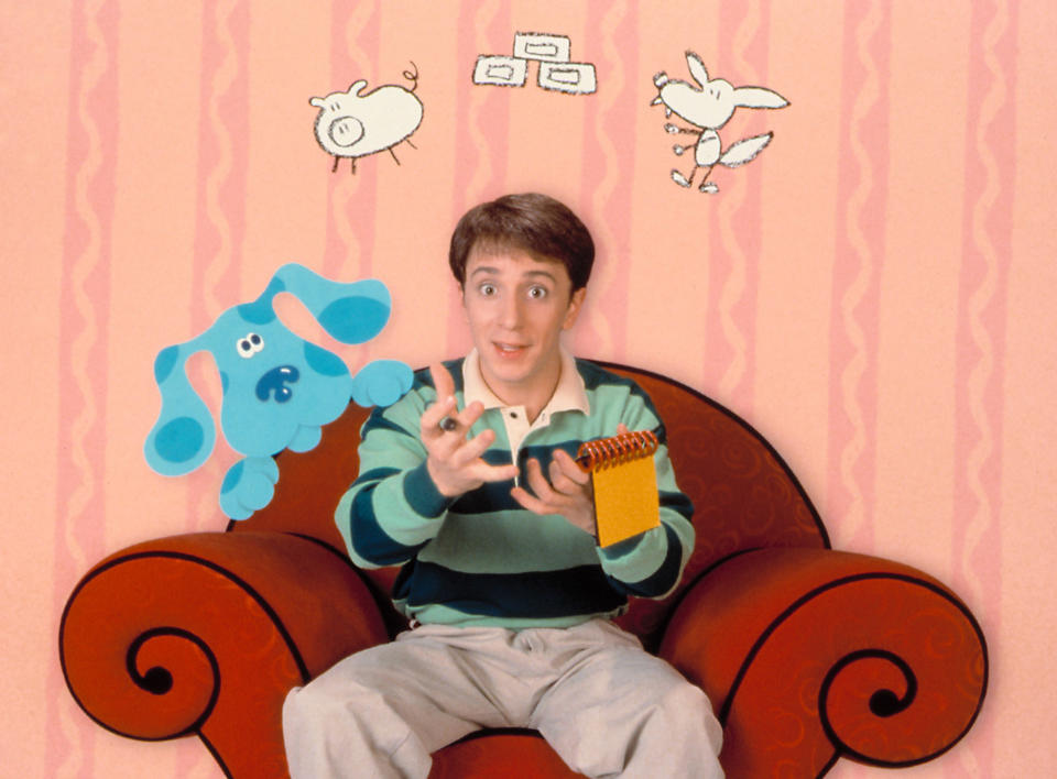 Steve with Blues on the cartoonish set of Blue's Clues